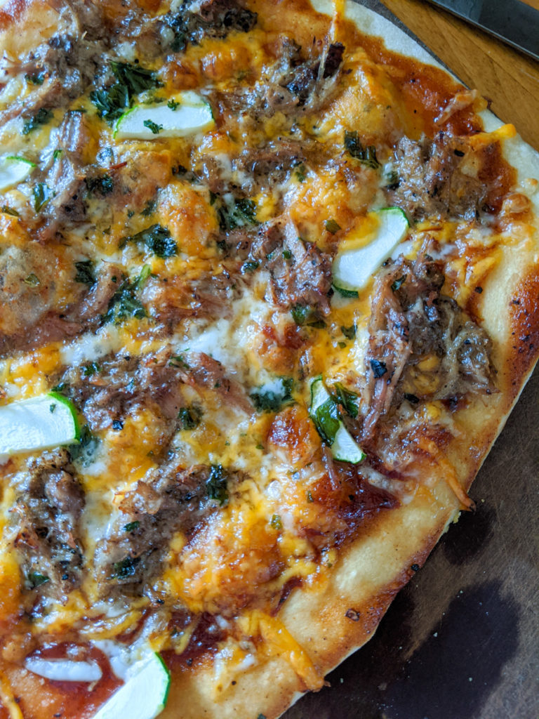 BBQ pizza with veggies and pulled pork