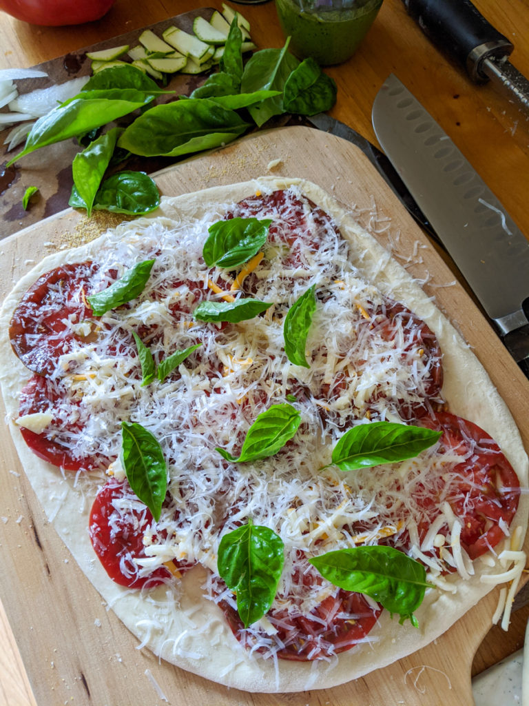 Caprese pizza with garden tomato, mozzarella and basil
