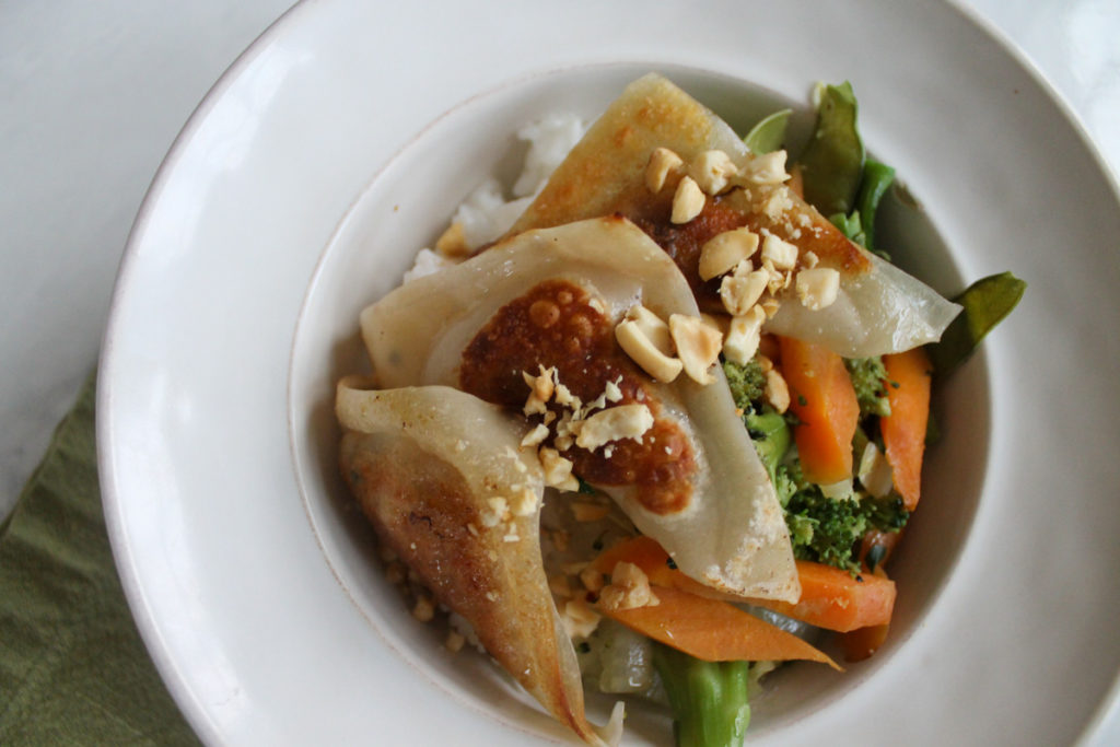 Chicken apple potstickers with veggies and white rice.