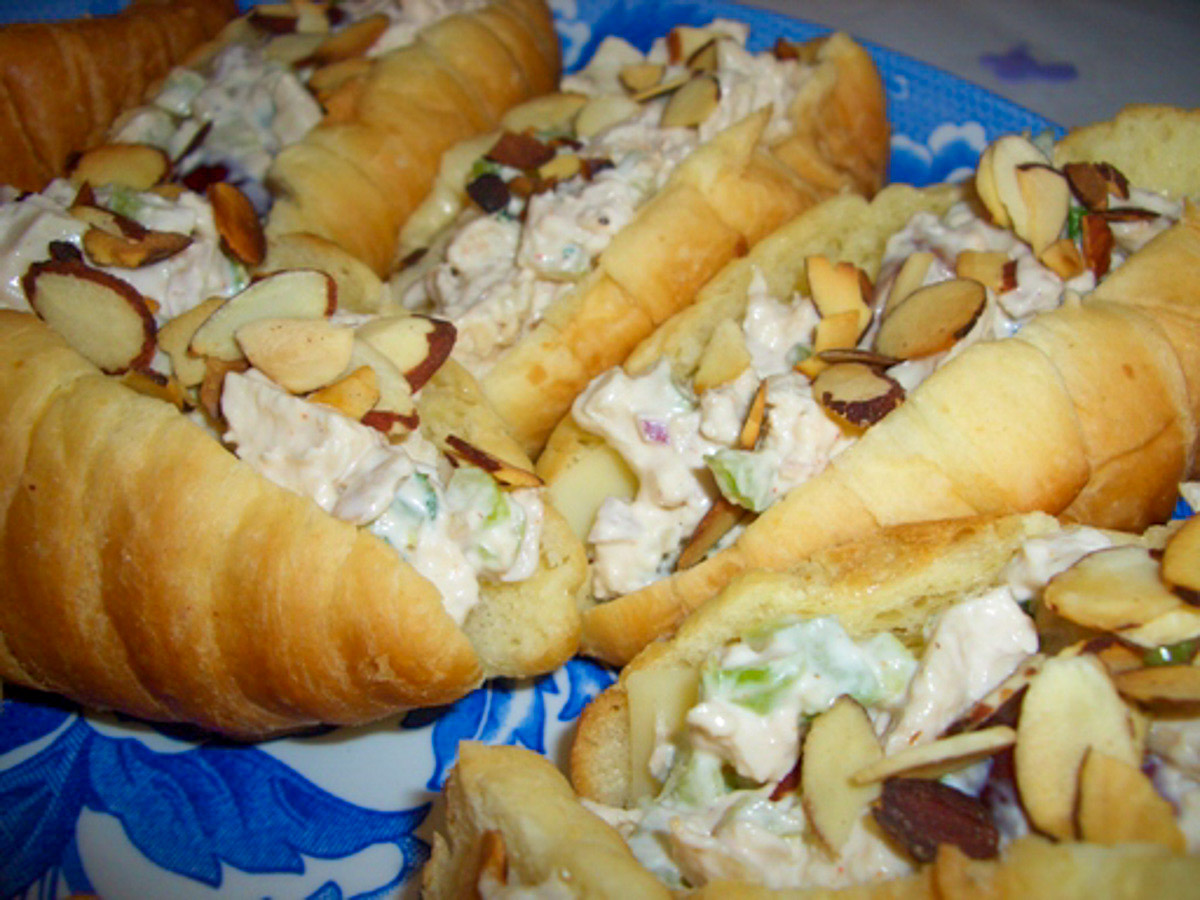 Croissants filled with chicken salad at topped with extra toasted almonds.