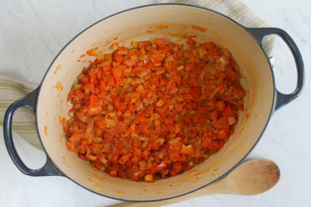 Sautéing onions, red bell pepper and tomato for chicken tortilla soup.