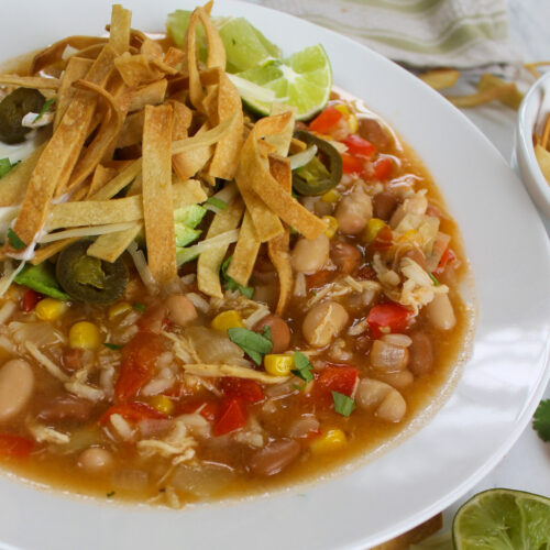 Chicken Tortilla Soup topped with homemade salty lime tortilla strips.
