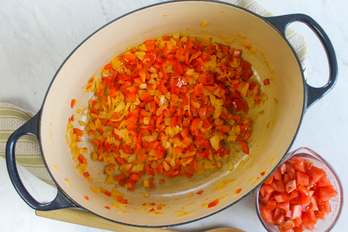 Sautéing onions and red bell pepper for chicken tortilla soup.