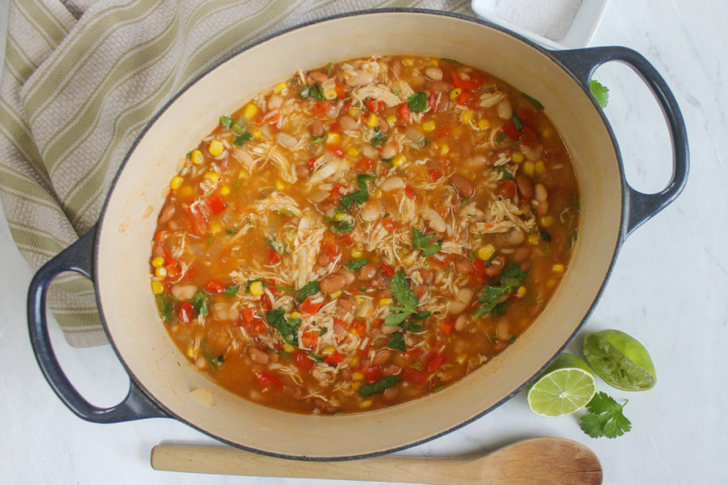 Finished pot of chicken tortilla soup with cilantro and lime juice.