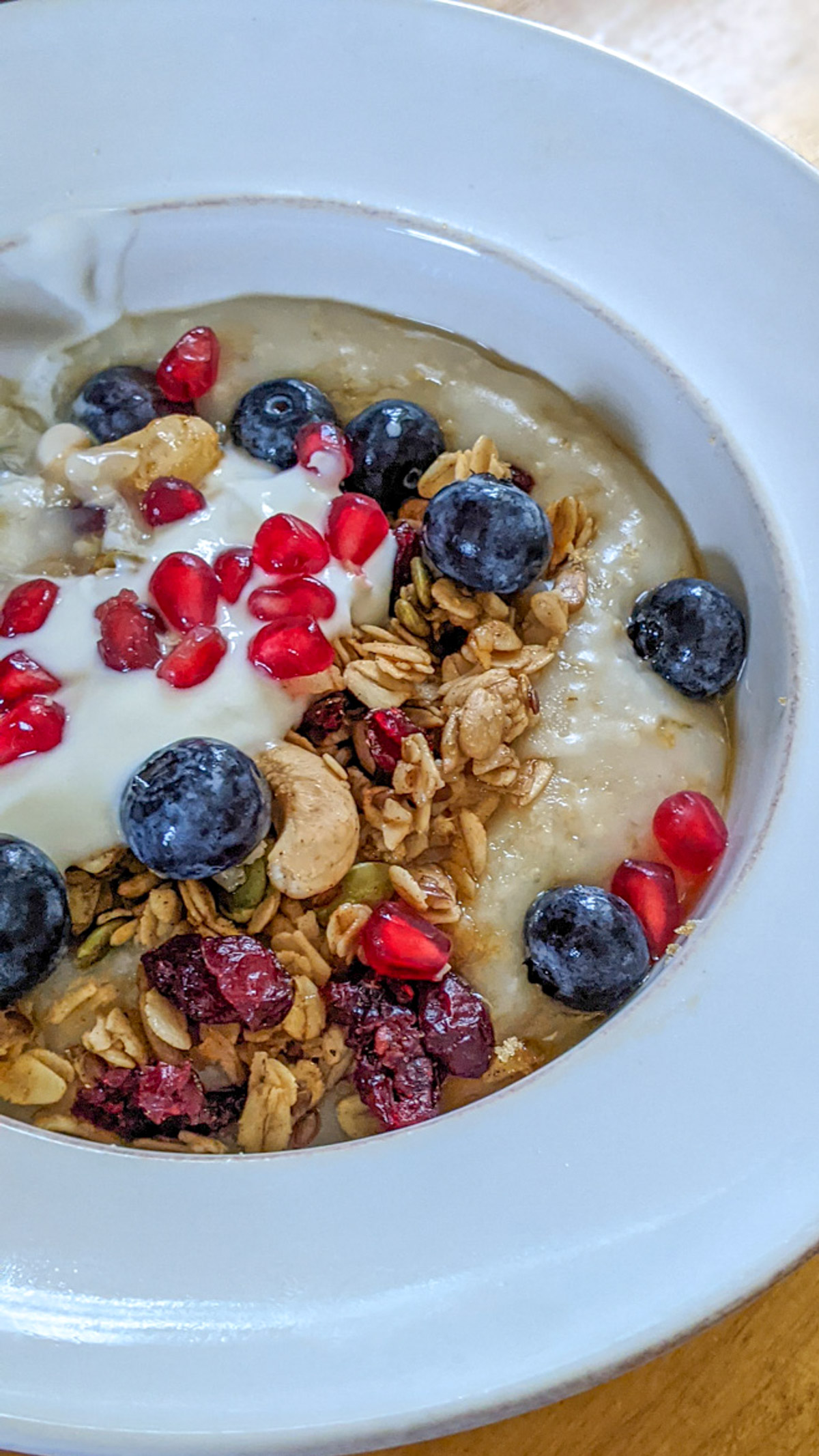 Crockpot Steel Cut Oatmeal with blueberries and pomegranate seeds.