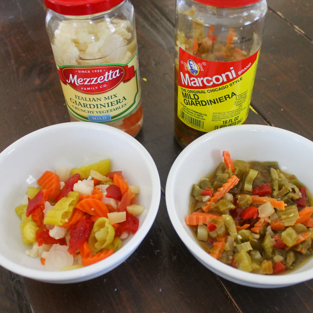 Two different kinds of pickled veggie giardiniera, one oily, one vinegary.