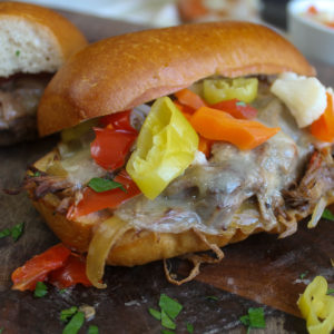 Italian Beef Sandwiches with provolone cheese and giardiniera.