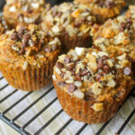 Morning glory healthy muffins on a wire rack made with fruit and vegetables.