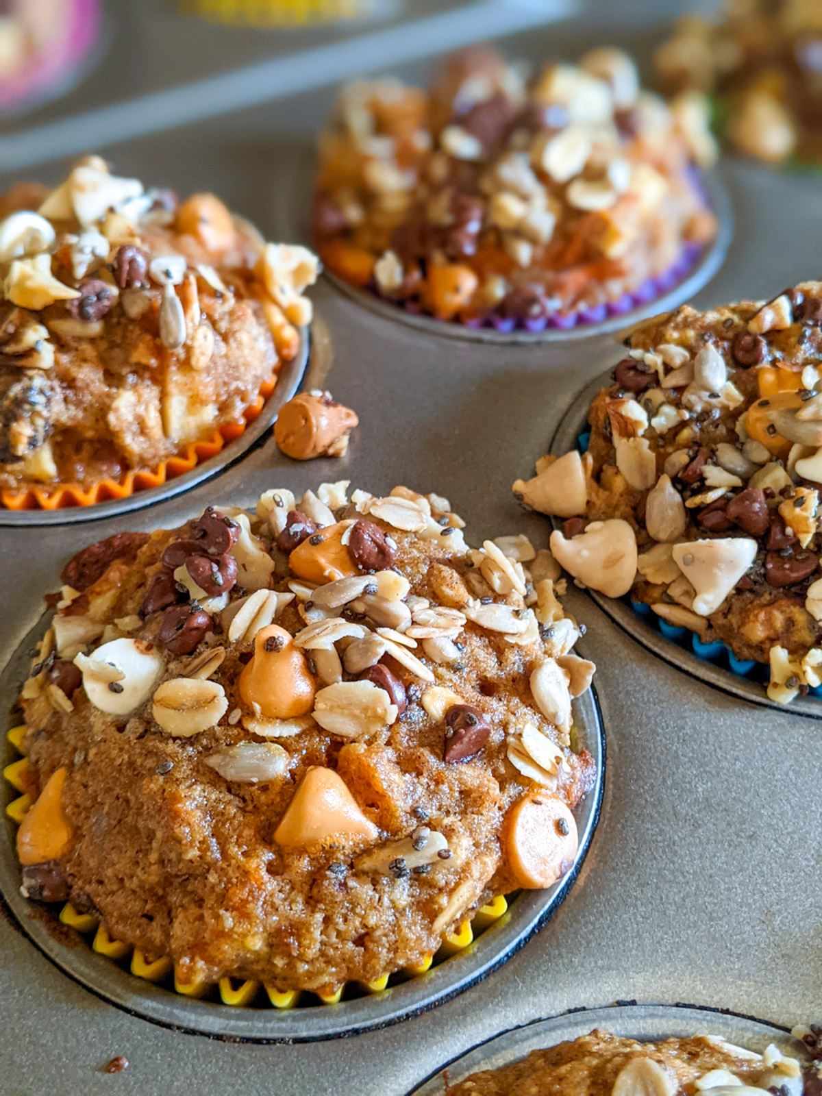 A muffin tin with the baked morning glory muffins.