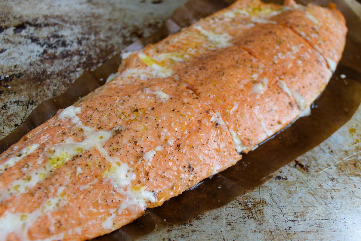 A cooked filet of salmon seasoned with just salt and pepper.