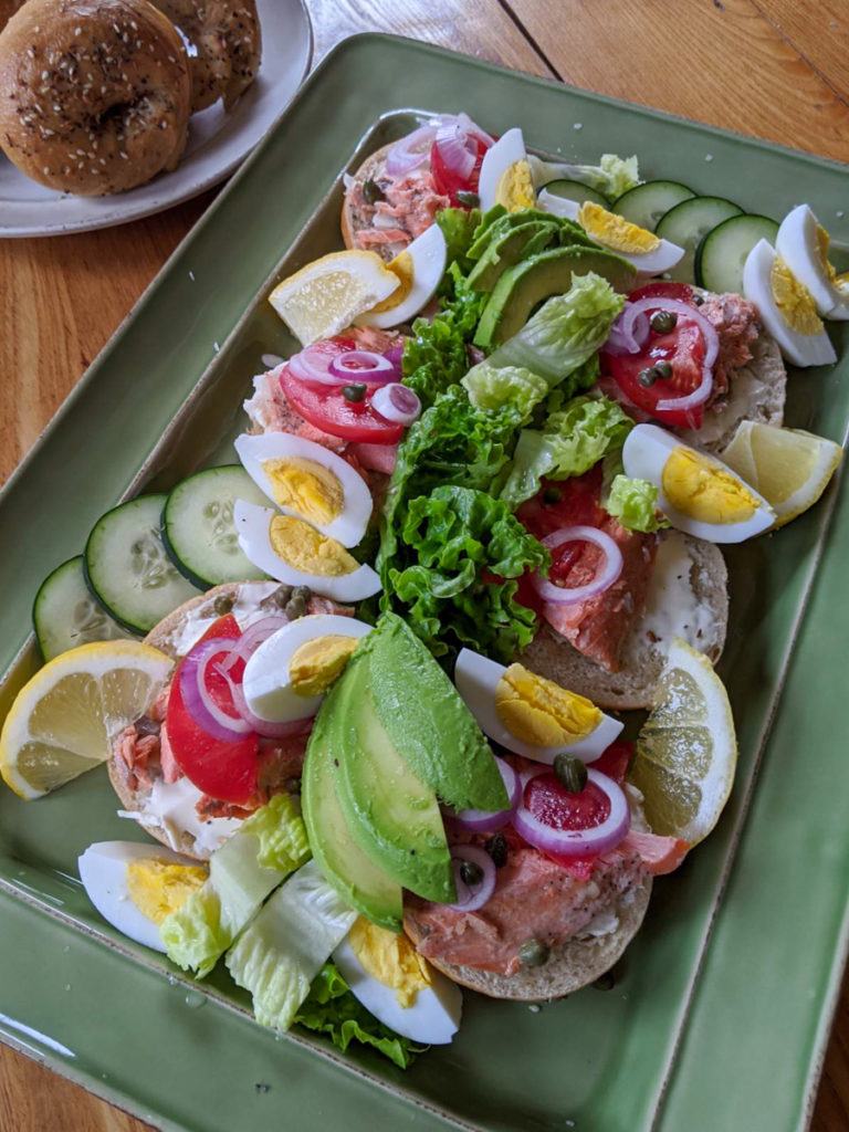 Salmon avocado bagel platter for dinner.