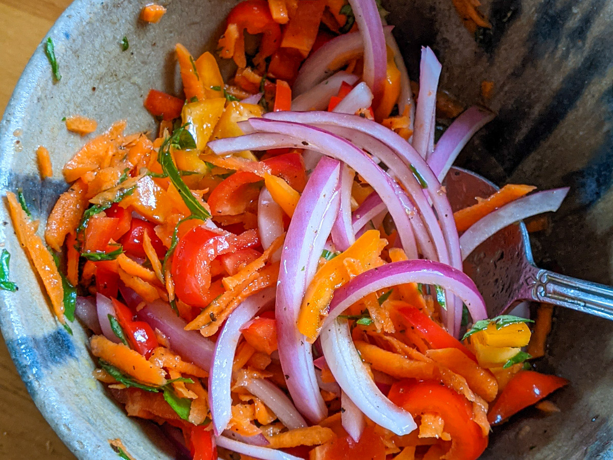 Bowl of homemade fresh giardiniera veggies in vinegar mix.