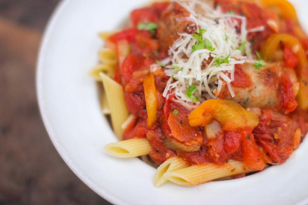 Suasage peppers and onions pasta sauce over penne.