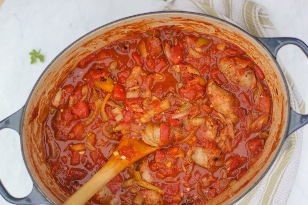 Hearty pot of tomato marinara sauce with sausage, onions, peppers and fennel.