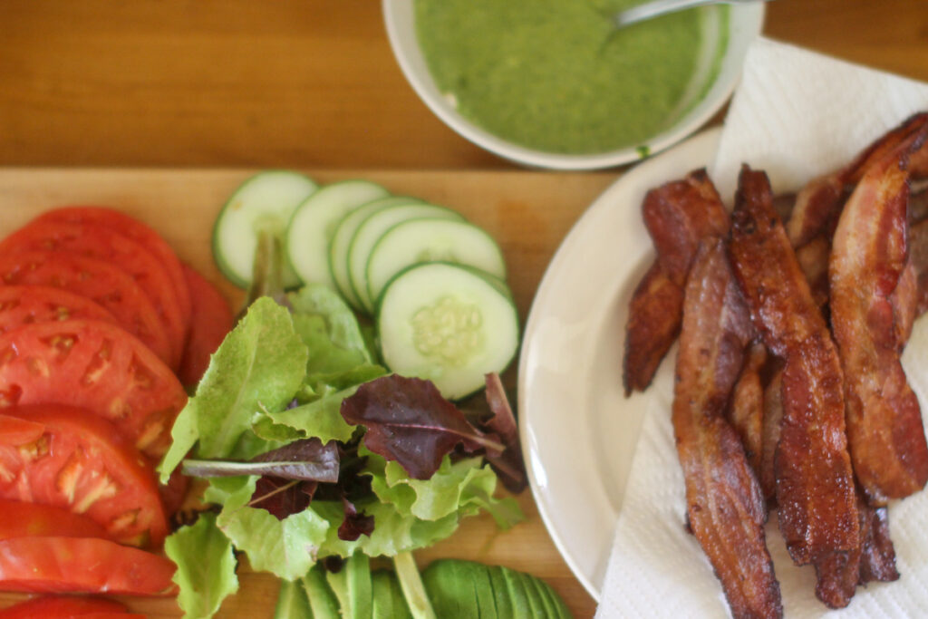 Pesto BLT ingredients, bacon, lettuce, tomato, cucumber and pesto aioli.