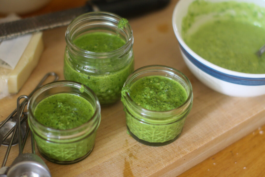 A bowl of pesto aioli for BLT's and 3 extra small jars of pesto to freeze.