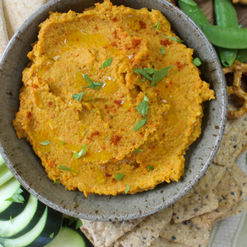 Roasted Carrot Hummus with pita, cucumber and pea pods.