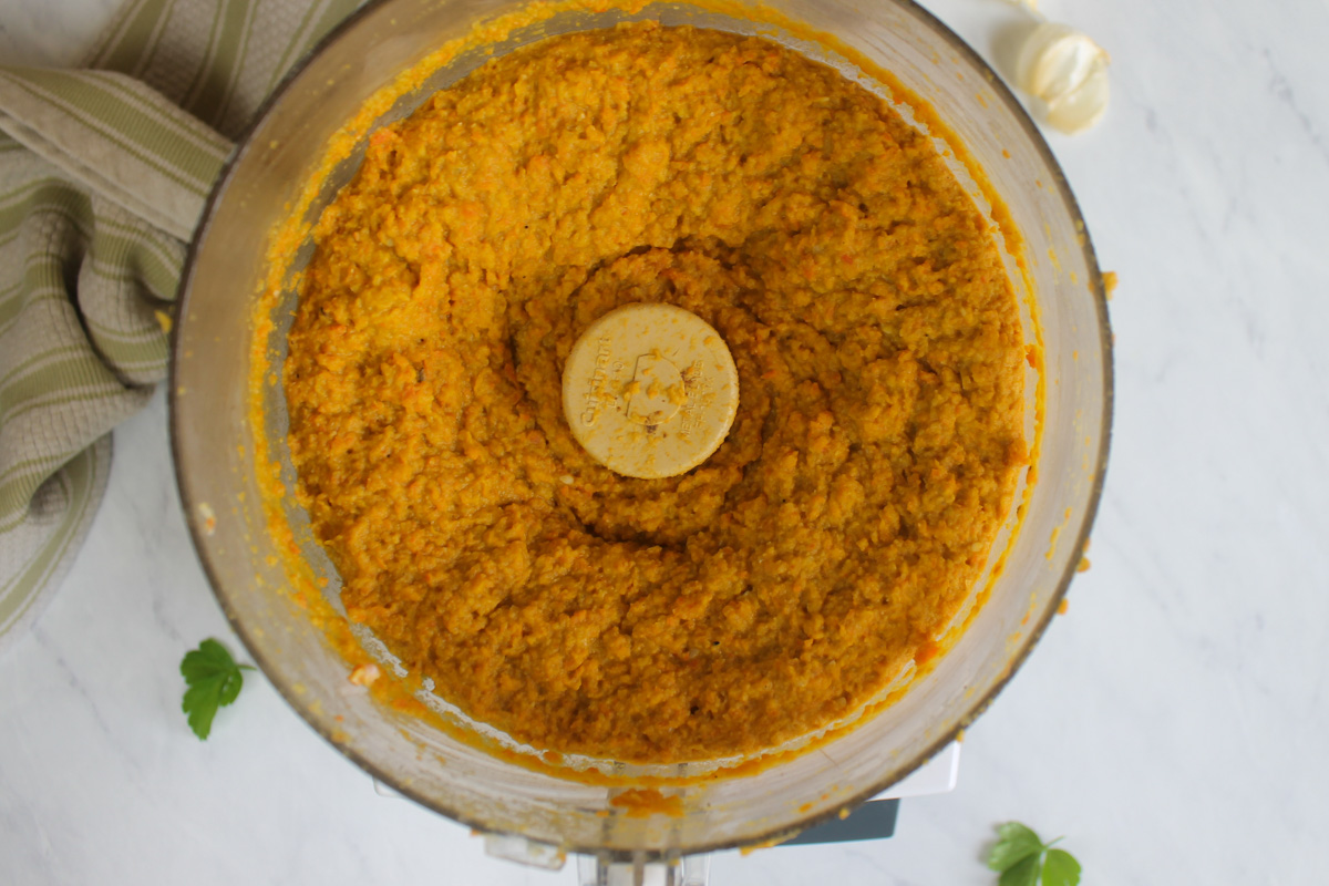 Roasted carrot protein hummus made in a food processor.