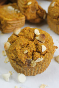 A close up of one Banana Carrot Oatmeal Muffin.