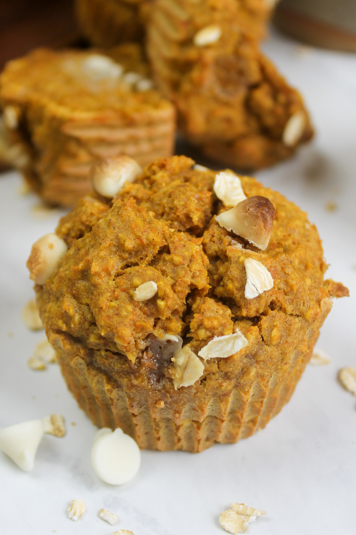 A close up of one Banana Carrot Oatmeal Muffin.