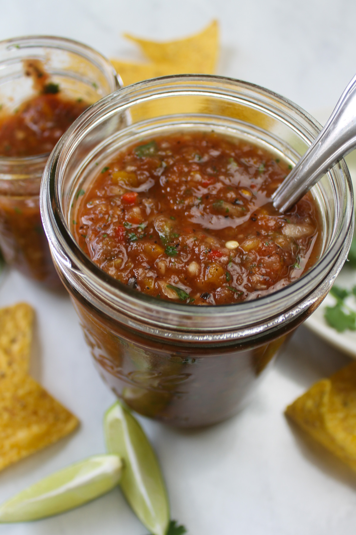 Two jars of salsa ready to be stored, about 3 cups total.