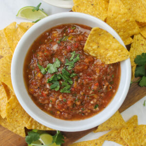A bowl of healthy chips and salsa.