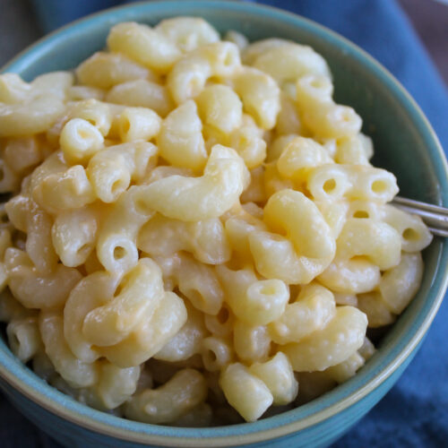 A full bowl of creamy macaroni and cheese.