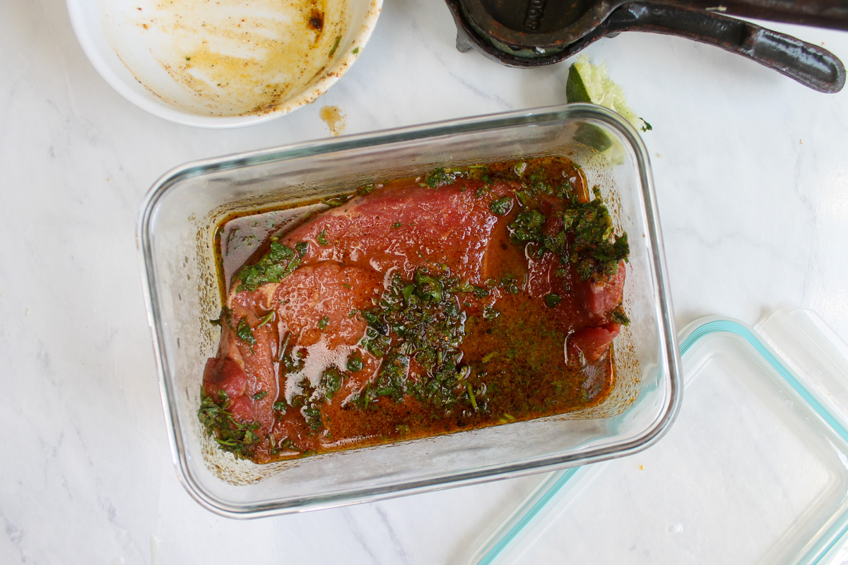 Sirloin steak marinating for fajita tacos.