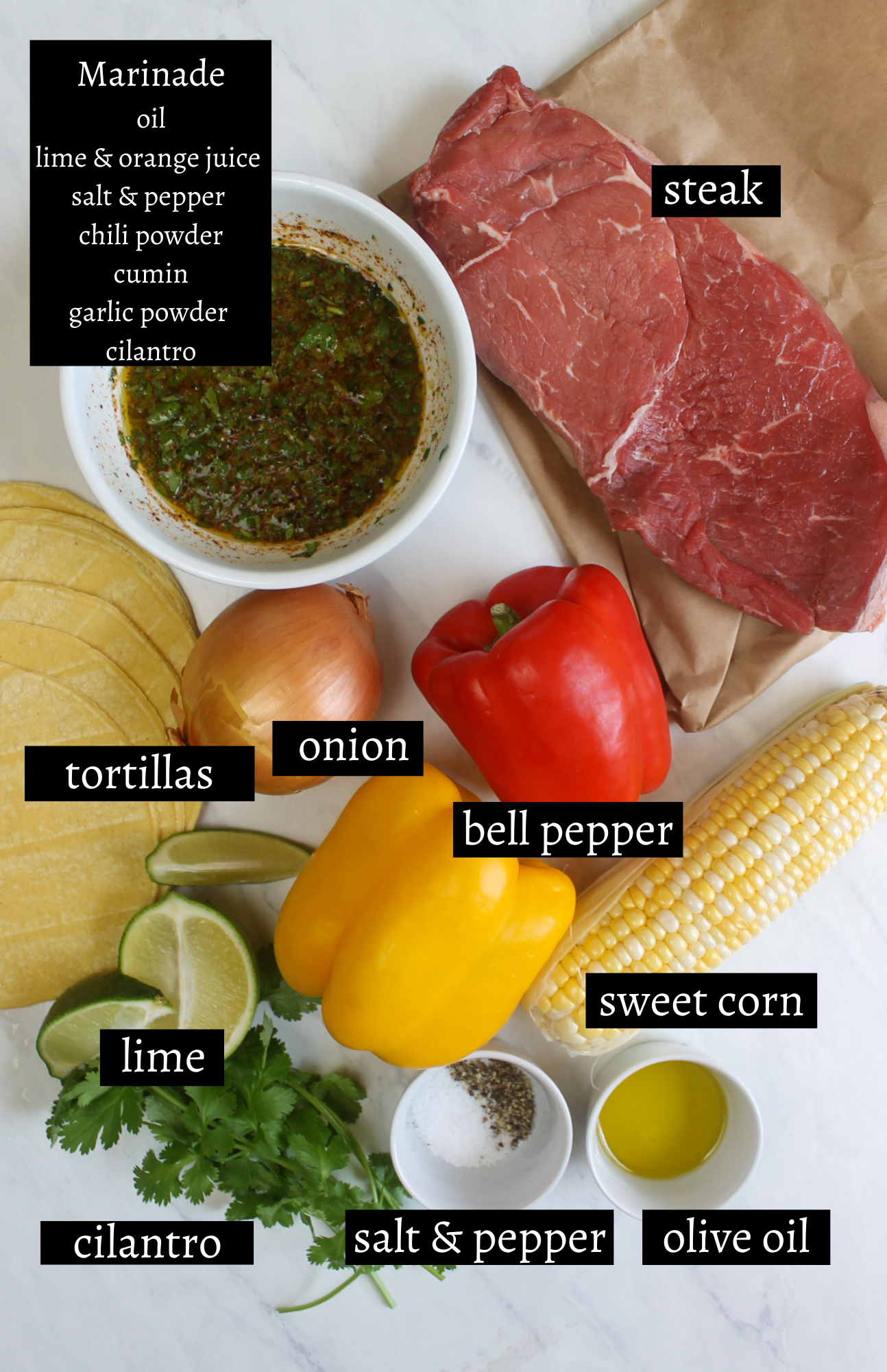 Labeled ingredients for steak fajita tacos with pepper, onions and corn.