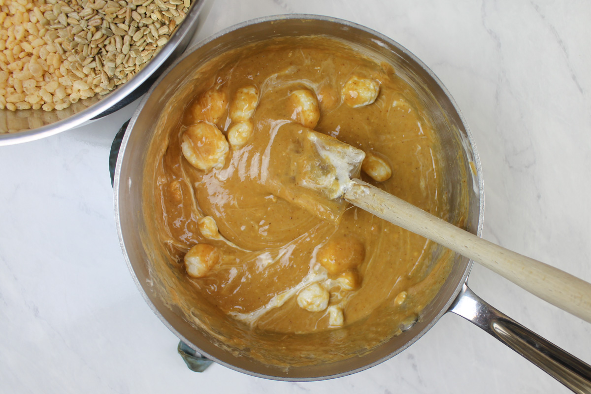 Peanut butter marshmallow mixture melted together, light brown in color.