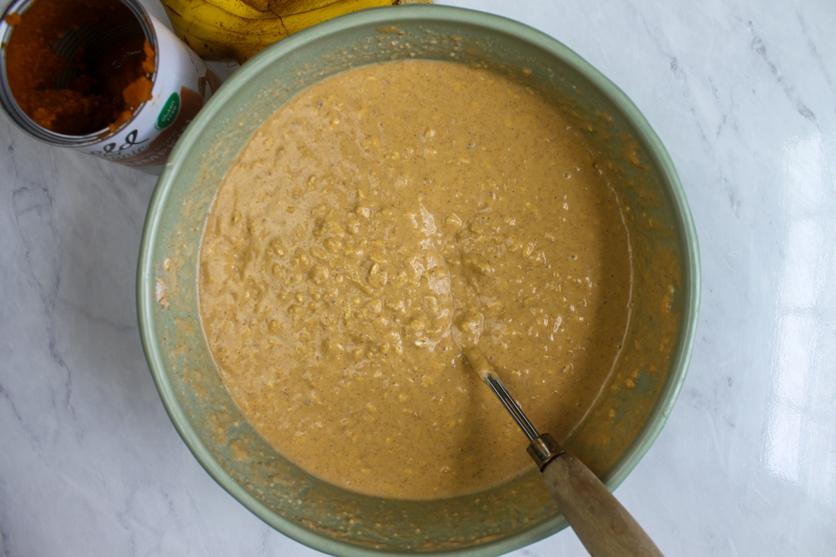 Pumpkin Protein Waffle batter mixed in a green bowl.