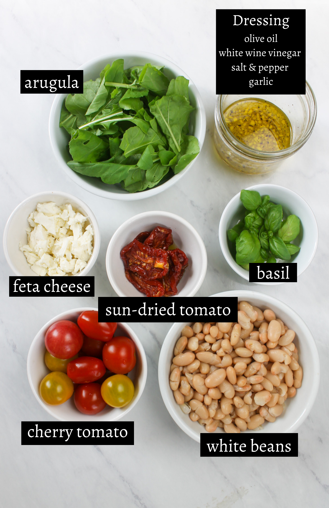 Labeled ingredients for Tomato Feta White Bean Salad with Arugula.