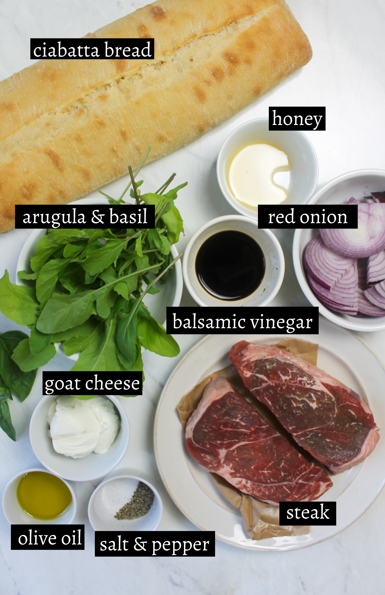 Labeled ingredients for ciabatta steak sandwiches with balsamic onions.