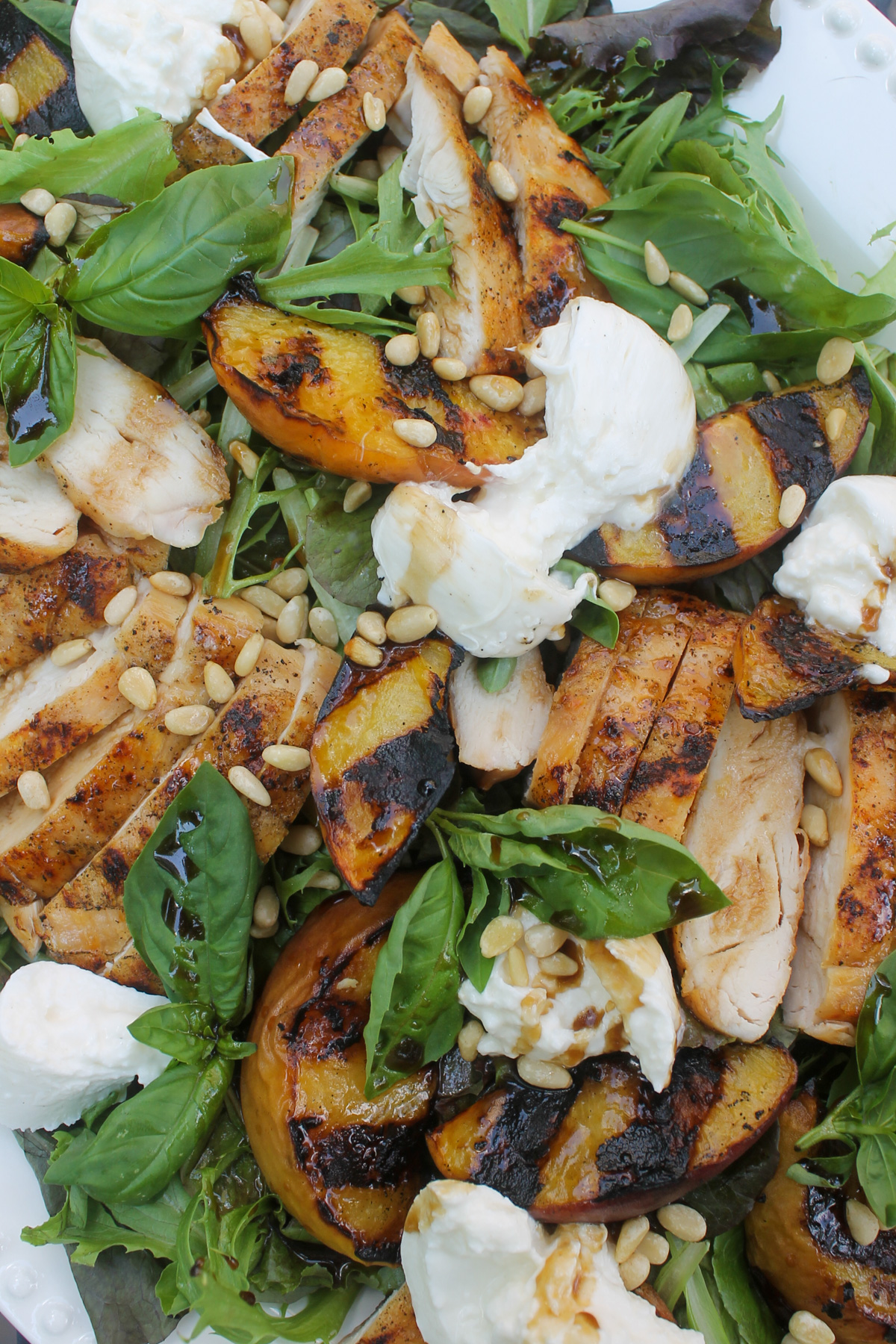 Grilled peach salad with honey balsamic vinaigrette.