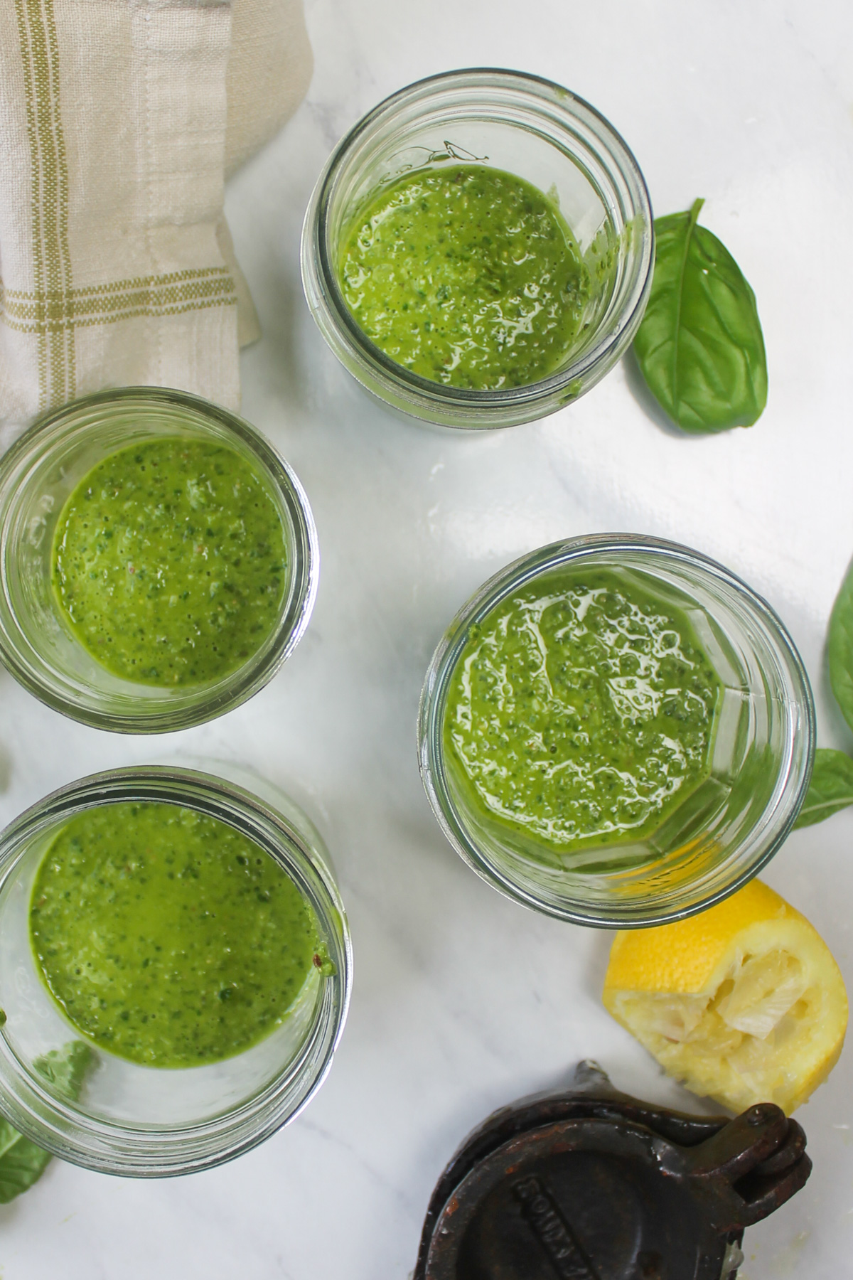 Four jars of garden pesto for the freezer.