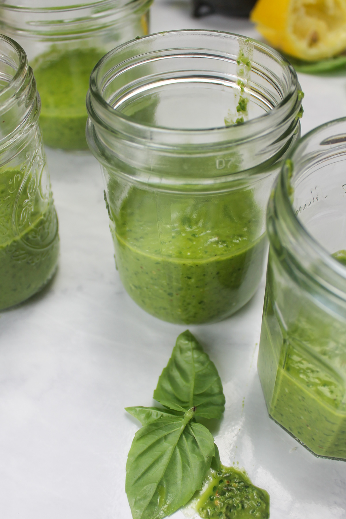 Jars of pesto ready to be frozen.