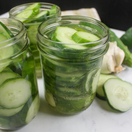 Three jars of small batch refrigerator pickles.
