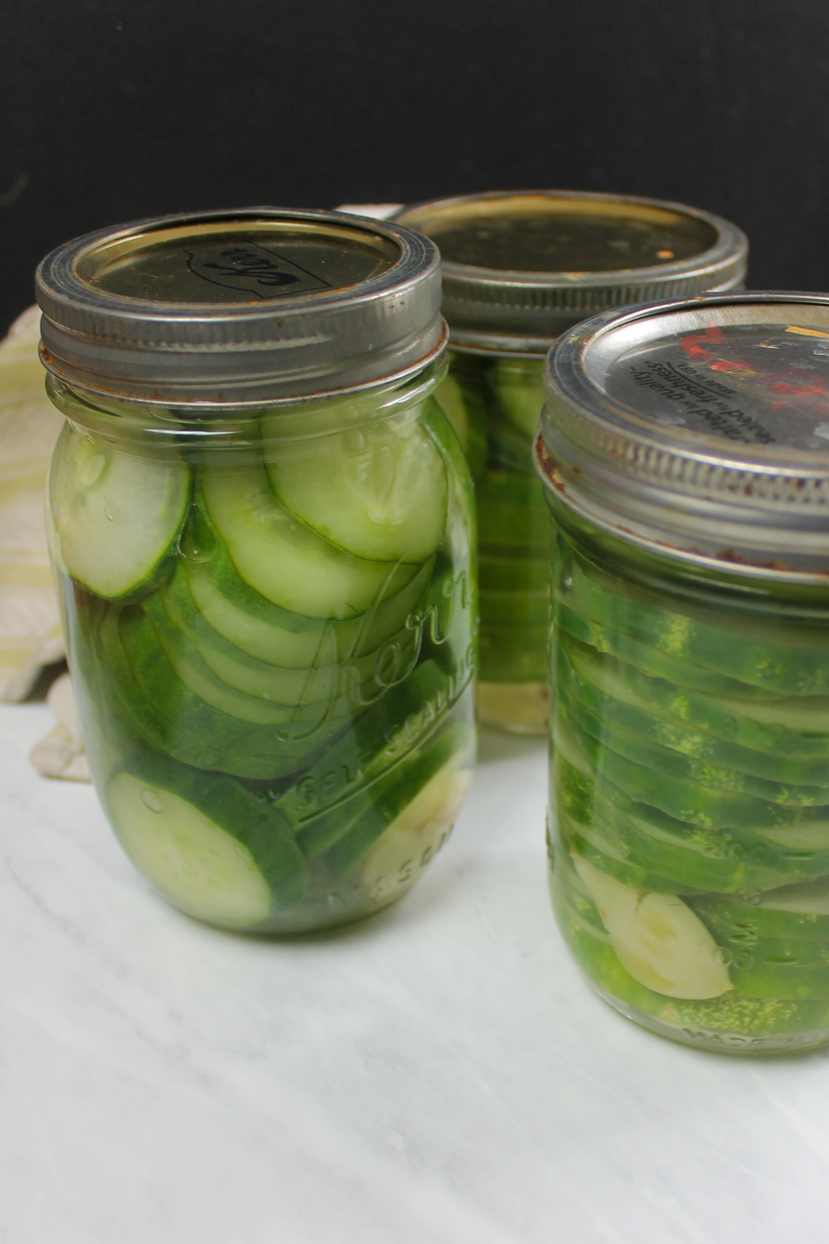 Jars of small batch pickles with lids, ready for the fridge.