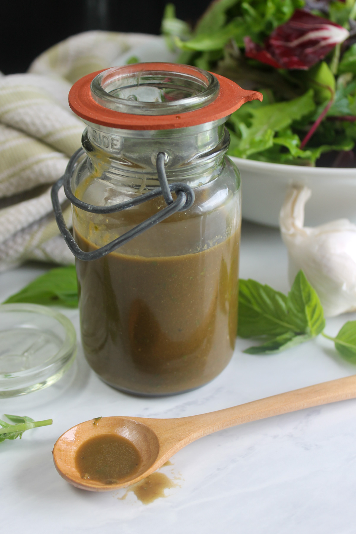 Honey basil balsamic vinaigrette dressing with a green salad.