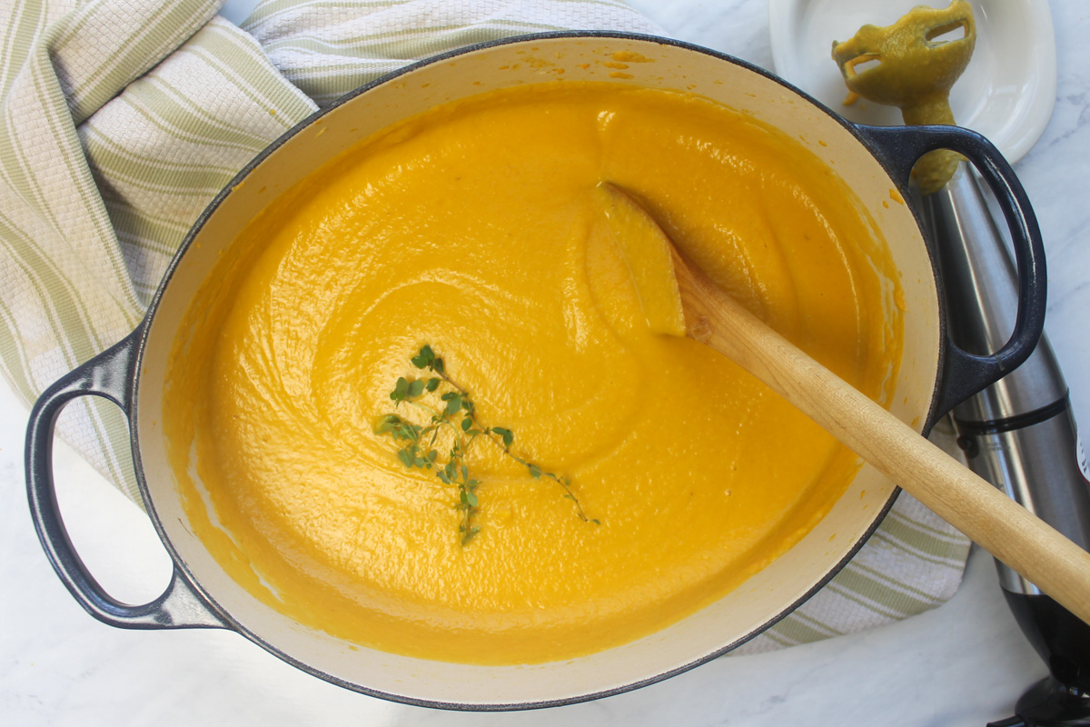 Blended butternut squash carrot soup with a hand held immersion blender.