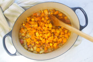 The pot of soup with the butternut squash from the oven added back in.