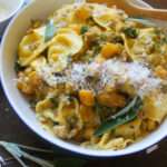 Squash ravioli sauce with sage and kale.