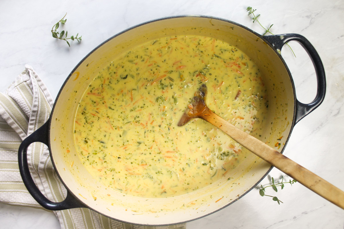 The finished pot of creamy cheesy broccoli zucchini soup.