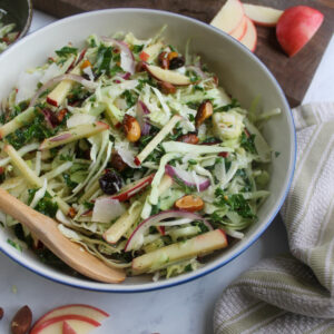 Crispy and healthy fall harvest slaw salad with apples and kale.