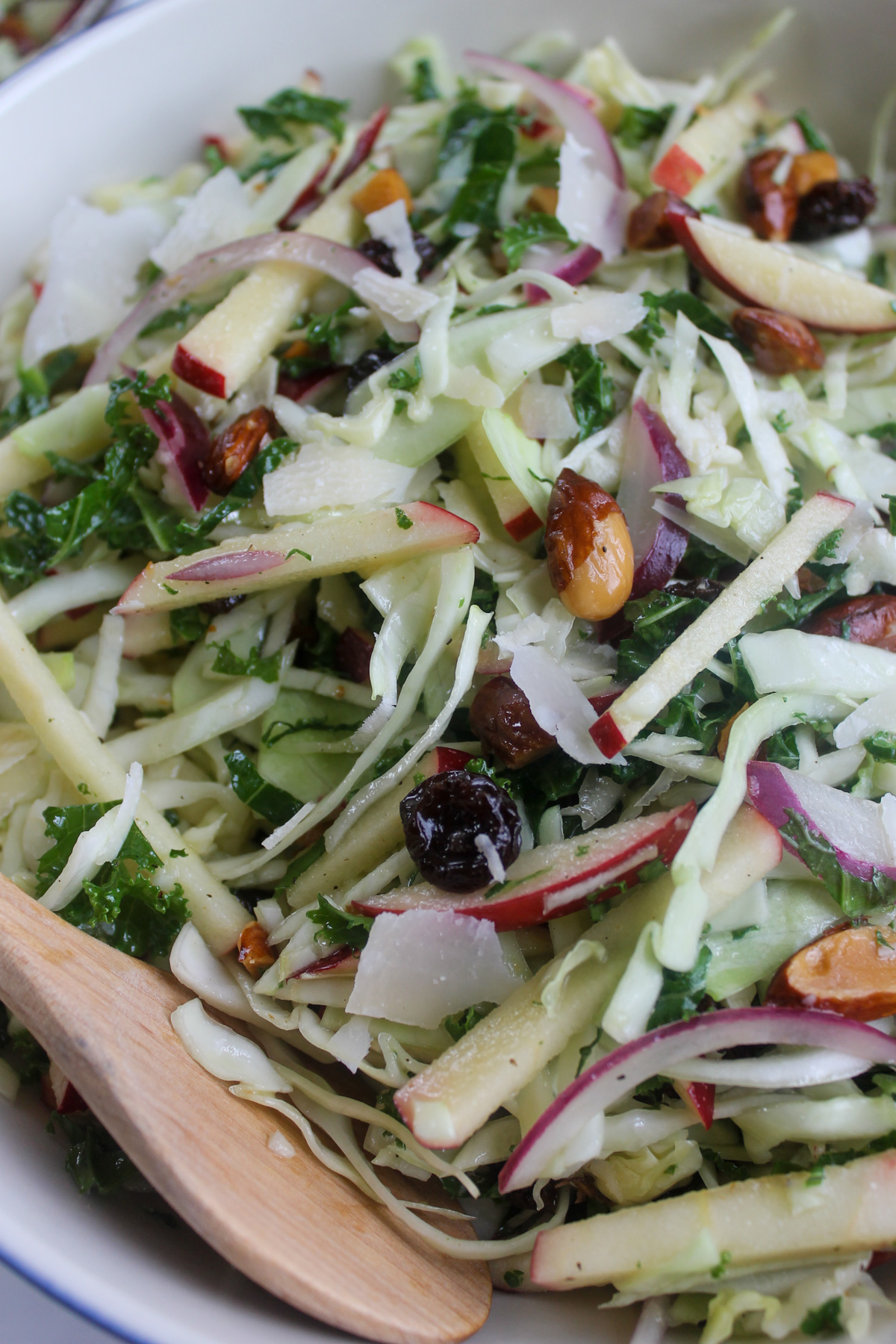 Autumn crunch salad with kale, apples, and sweet honey cider dressing.