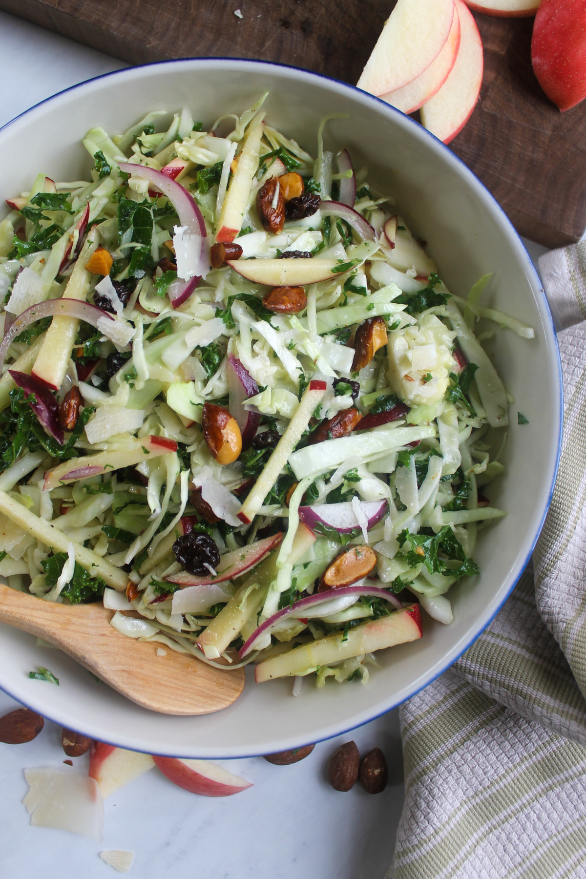 A bowl of kale apple coleslaw made with no mayo.