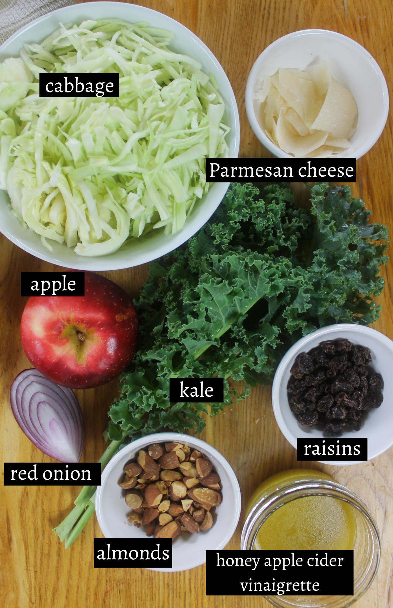 Labeled ingredients for Kale Apple Slaw with Honey Apple Cider Vinaigrette.