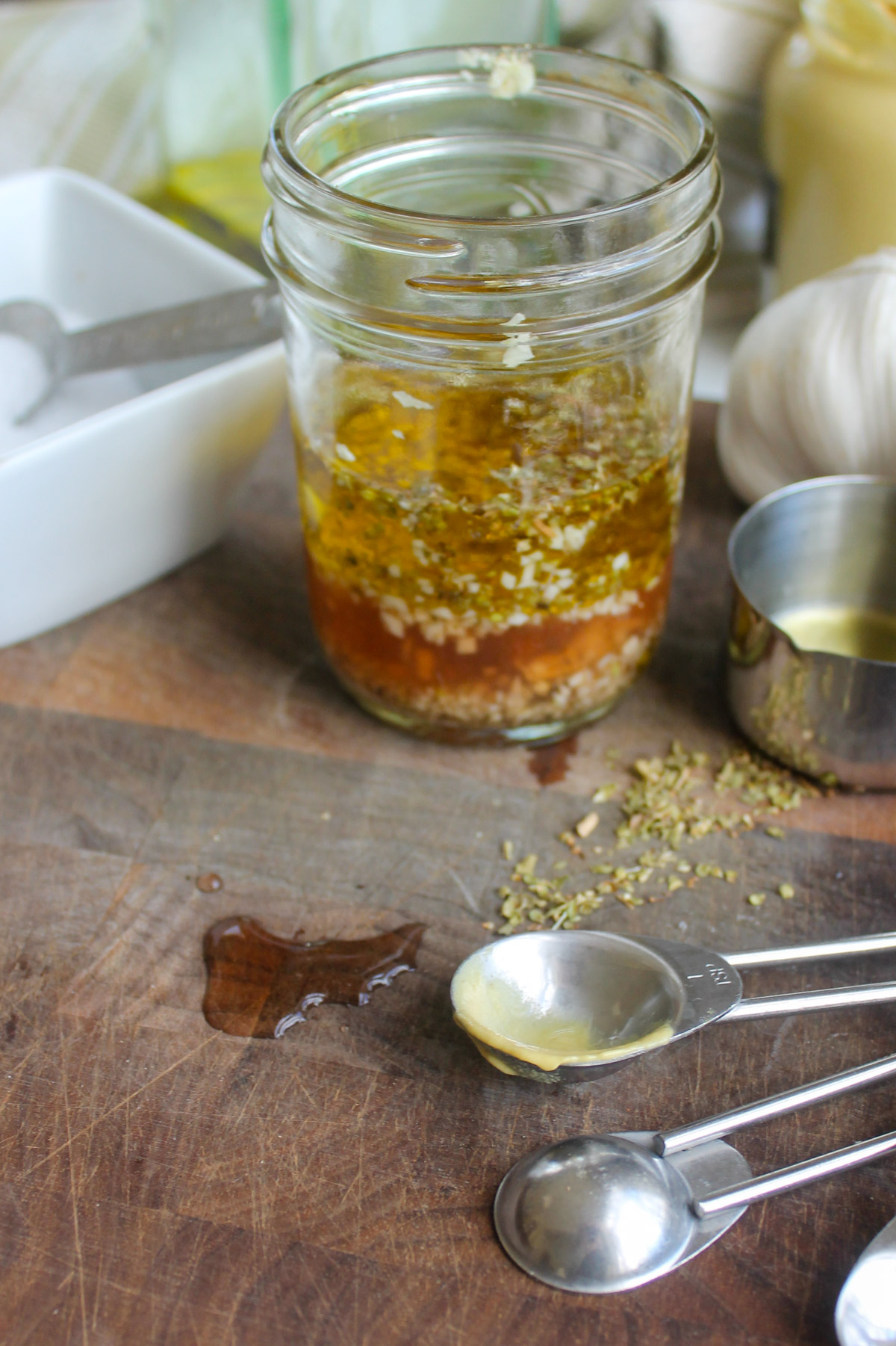 A jar of homemade red wine garlic vinaigrette salad dressing.