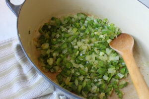 Sautéing onion and green pepper as the base for leftover turkey chili.