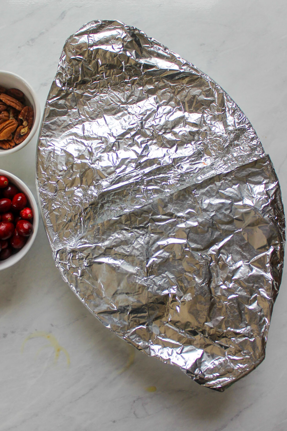 The butternut squash wrapped in foil and ready to bake.